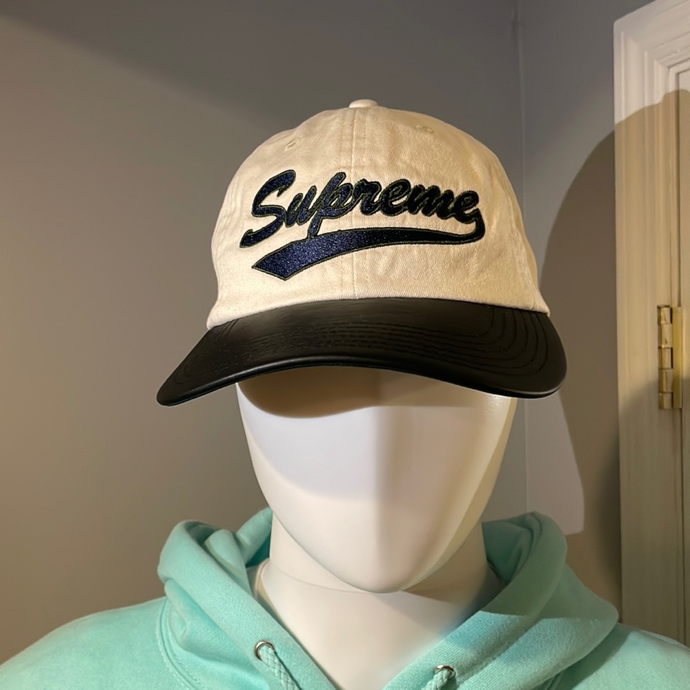NWT Supreme adjustable hat cream color with navy and green supreme embroidery